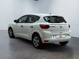 the rear end of a white car parked in a room