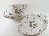 two plates that have birds on them on them