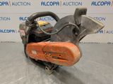 a chainsaw is sitting on a table in front of a sign