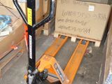 a pallet with a sign on it sitting in a warehouse