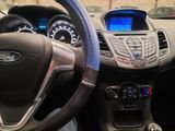 a close up of a steering wheel and dashboard of a car