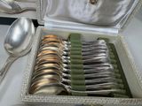 a box with silver spoons and silver spoons in it