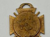 an image of a gold medal on a white surface