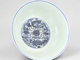 a blue and white plate with a picture of a tiger on it