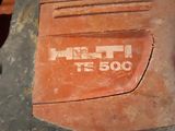 a close up view of a dirt mower on the ground