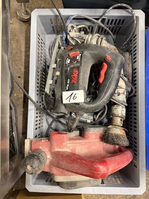 a box with tools in it sitting on the floor