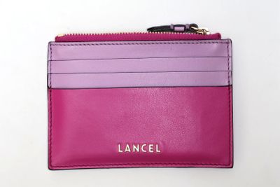 a close up of a pink and purple wallet with a zipper