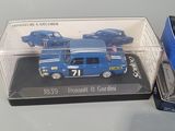 a box with a toy truck and a toy car in it