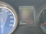 a close up of a car dashboard with various gauges