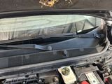 the engine of a car with a broken hood and a broken hood