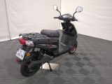 a scooter that is parked in a garage