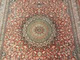 an image of a large oriental rug on a wooden floor
