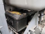 a metal box sitting on top of a machine