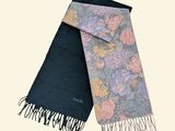 two scarfs with different designs on them on a white background