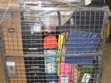 a metal cart with many items in it in a warehouse
