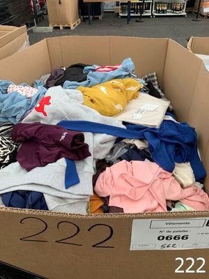 a cardboard box full of clothes in a store