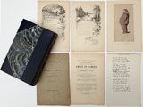 several old books are sitting on top of a white table