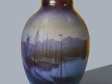 a vase with a painting of boats on it