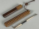three different types of canes and a cane holder on a table