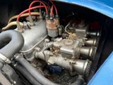 a close up of a car ' s engine in a blue car