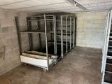 a room that has a bunch of shelves in it