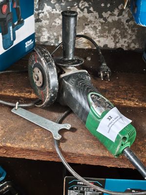 an image of a drill and other tools on a table