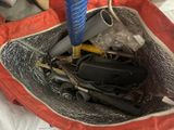 a bag filled with various tools and items in it