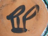 a picture of a cake with the letter p painted on it