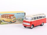 a toy bus that is sitting next to a box