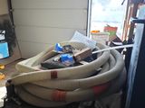 an image of a room with a lot of hoses in it