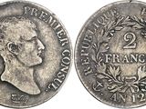 une pièce en argent portant le portrait d'un homme