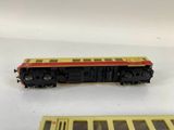 a close up of a toy train on a table next to a box