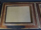 an image of a picture frame with a picture hanging on it