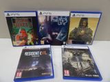 un lot de quatre jeux vidéo posés sur une table