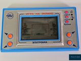 a blue and silver electronic game on a white table