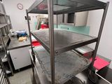 stainless steel shelvings in a commercial kitchen with lots of counter space