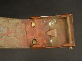 a belt that has a metal buckle on it