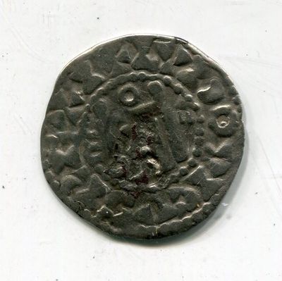 une vieille pièce de monnaie sur laquelle figure un homme, sur un fond blanc