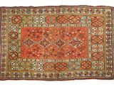 an orange rug with a diamond design on it