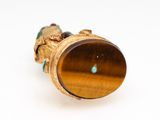 an image of a close up of a ring with a tiger ' s eye on it