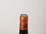 a bottle of wine that is sitting on a table