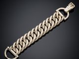 a gold chain bracelet with a clasp on a black background