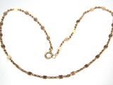 gold plated necklace with faceted glass beads and a clasp