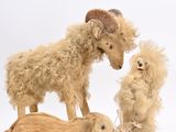 three stuffed animals that are standing next to each other