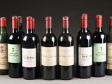 several bottles of wine are lined up in a row