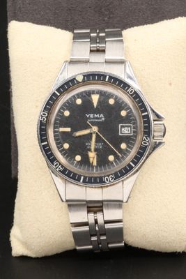 an image of a watch sitting on top of a pillow on a table
