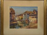 an image of a painting of a river and buildings in a gold frame