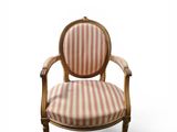 an image of a wooden chair with a striped upholstered seat