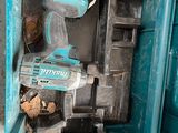 a blue tool box with a cordless drill in it