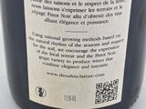 a close up of a bottle of wine on a table
